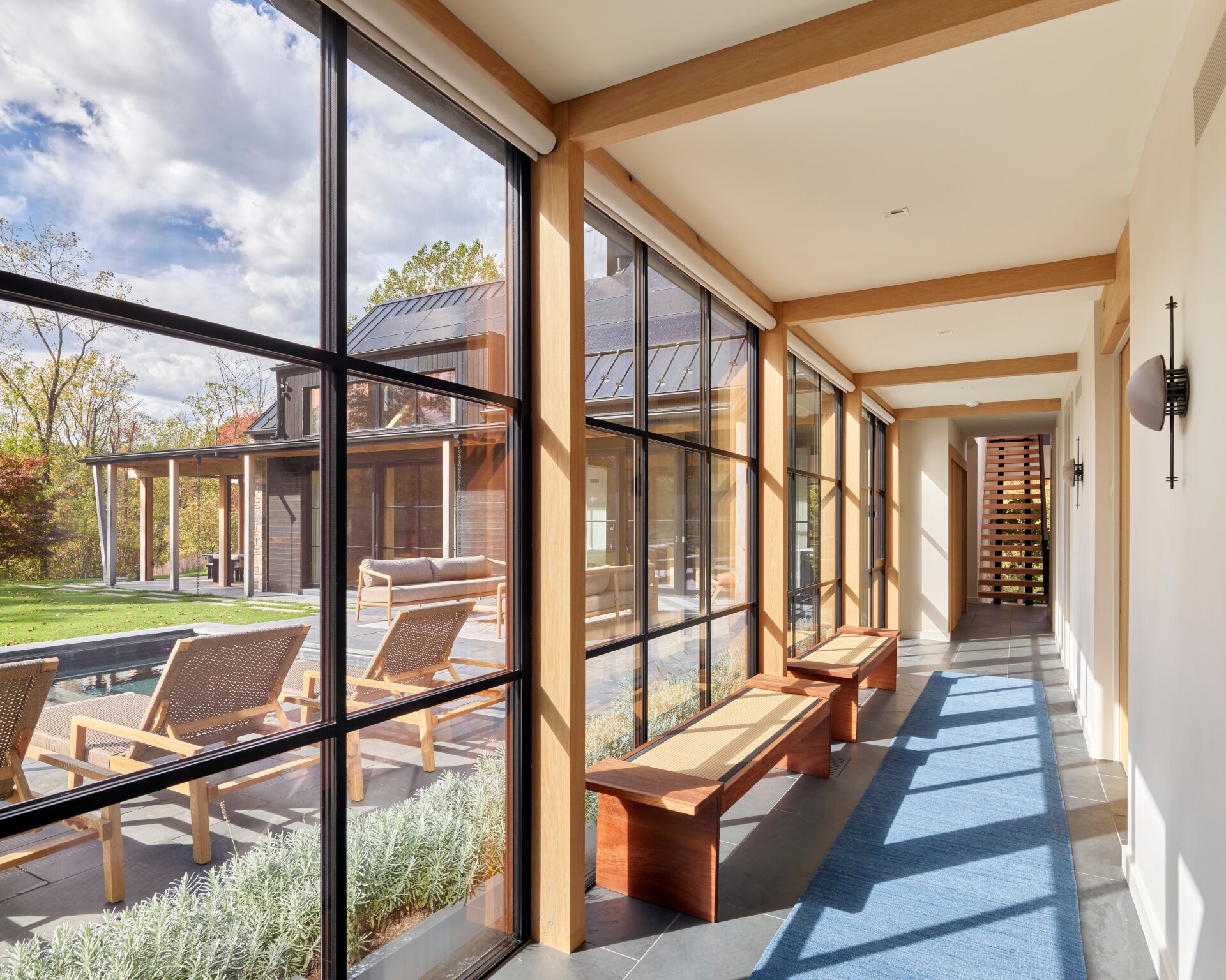 Energy-efficient modern farmhouse with reclaimed wood siding